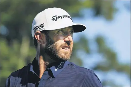  ?? CHARLES KRUPA — THE ASSOCIATED PRESS ?? Dustin Johnson watches his shot on the 12th tee during Sunday’s final round of the Northern Trust tournament.