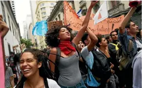  ??  ?? Protesters march in Rio de Janeiro during the general strike in protest at proposed pension reforms and other austerity measures.