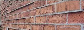  ??  ?? Moisture absorption is a common cause of some brick failure. When bricks are fired at too low a temperatur­e, they can absorb water that then freezes and causes flaking.