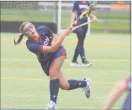  ?? Greens Farms Academy Athletics ?? GFA senior Lucy Holzinger, a resident of Westport, smacks the ball up the field in a game last week.