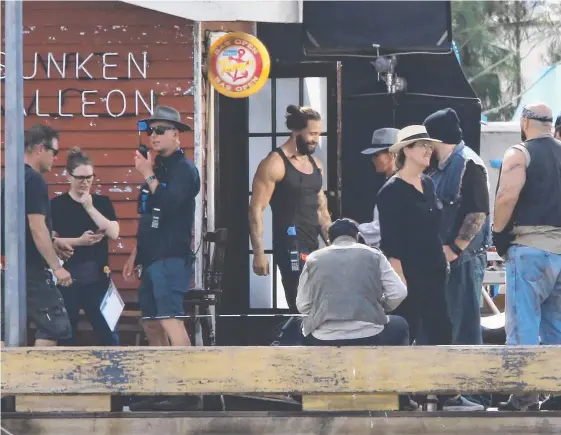  ??  ?? Bikies invade the Gold Coast again — to film scenes for Aquaman at The Spit. Below: Jason Momoa shows off his character’s fish-scale tattoos. Picture: GLENN HAMPSON