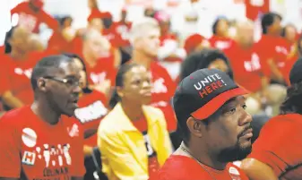  ?? Isaac Brekken / Special to The Chronicle ?? Culinary union members rally before heading out to encourage voters to cast ballots in Las Vegas. For many of the union workers, the vote is personal; they are fighting the boss.