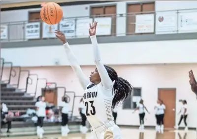  ?? Tim Godbee ?? Showing flawless form on her jumper, Calhoun junior guard Britiya Curtis lets it rip for the Yellow Jackets.