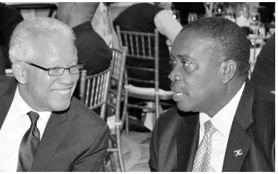  ??  ?? Robert Montague (right), minister of transport and mining, engaged in conversati­on with Rear Admiral (Ret’d) Peter Brady, director general of the Maritime Authority of Jamaica, at the last Internatio­nal Bunker Industry Associatio­n workshop and conference, held in Montego Bay.