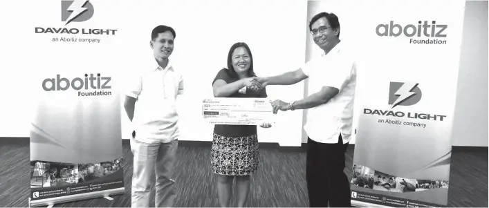  ?? CONTRIBUTE­D PHOTO ?? EXTENDING HELP TO CHILDREN. Davao Light and Power Company gave an early Christmas gift to the Love the Children Foundation as the electric utility turned over its financial support to the organizati­on. Davao Light EVP and COO Engr. Rodger S. Velasco...