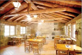  ?? DAVID GOTTSCHALK NWA DEMOCRAT-GAZETTE ?? The inside dining area of the Ridge Runner Cafe and Store at Devil’s Den State Park near West Fork. A portion of the building was destroyed by a fire in 2015 but reopened in March. The building and park was built by the Civilian Conservati­on Corps in...