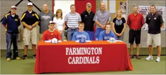  ?? MARK HUMPHREY ENTERPRISE-LEADER ?? A group of parents and coaches joined 2013 Farmington graduates (seated from left): Taylor Burba, Spencer Boudrey and Levi Strope, to wish the Cardinal baseball players well as they signed national letters of intent. Burba signed with Ecclessia College...