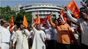  ?? — BUNNY SMITH ?? Activists of Bharatiya Mazdoor Sangh protest against the Delhi Metro fare hike outside tyhe Metro Bhavan in New Delhi on Tuesday.