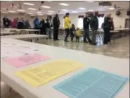  ?? EVAN BRANDT — DIGITAL FIRST MEDIA ?? Turnout was brisk for the two Douglass (Mont.) Township voting districts that cast their ballots at the Gilbertsvi­lle