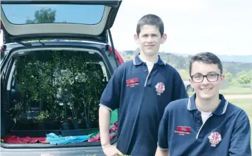  ??  ?? Left: Drouin Secondary College Leo program members Daryl Storey and Kaiden Levingston were kept busy delviering plants to peoples’ car during last year’s Garden and Home Expo.The Leo Club will continue to offer the service at this year’s event; File photograph.