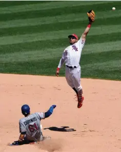  ?? Associated Press ?? Texas Rangers' Robinson Chirinos (61) steals second base as Chicago White Sox second baseman Yolmer Sanchez (5) cannot handle the throw during the fourth inning of a baseball game Sunday in Chicago.