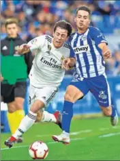  ?? AFP ?? ■ Real Madrid's Alvaro Odriozola (L) vies with Alaves's Ruben Duarte during their La Liga clash in Vitoria on Saturday.