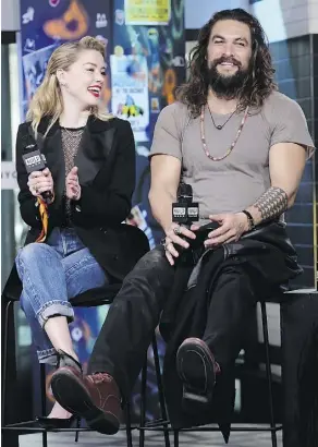  ?? THE ASSOCIATED PRESS ?? Amber Heard and Jason Momoa star in Aquaman, which dominated in China over the weekend and opens in Canada next week.