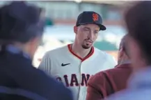  ?? AP PHOTO/ROSS D. FRANKLIN ?? New San Francisco Giants pitcher Blake Snell speaks to agent Scott Boras after Blake was introduced during the March 20 news conference in Scottsdale, Ariz.