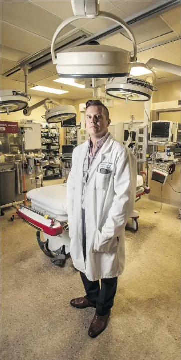  ?? JOE O’CONNOR / NATIONAL POST ?? St. Michael’s Hospital trauma surgeon Dr. Bernard Lawless, 49, was the first surgeon to arrive after the Danforth Avenue shootings last Sunday evening. The night had been so quiet he was just settling in to watch the news when he was notified that four patients with gunshot wounds were en route to the trauma bay.