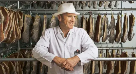  ?? Interview by Sophie Foster. Photograph­s by Joseph Brotherton ?? Above Colin Woodall in his drying room. Right Smoked pancetta air drying. Far right Woodall’s has expanded into salami and other charcuteri­e.