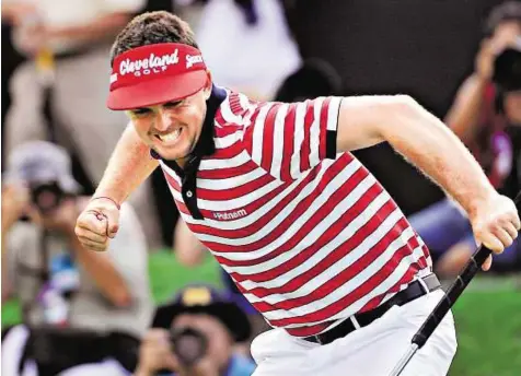  ??  ?? Way to go Keegan Bradley celebrates after making a par putt on the 18th hole to win the Bridgeston­e Invitation­al golf tournament at Firestone Country Club in Akron, Ohio, on Sunday.
AP