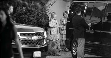  ?? Associated Press ?? Democratic presidenti­al candidate Hillary Clinton, center left, leaves the home of Marcia Riklis, center right, following a private fundraiser on Sunday in Southampto­n, N.Y.