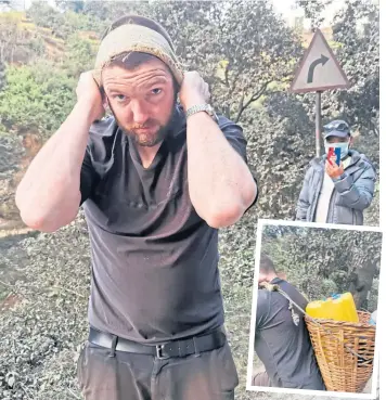  ?? ?? HEAD STRONG: Ian Bent of The Bimiri Foundation carries 20 litres of water in a basket on his back, inset, but the weight is supported via a headband across his forehead.