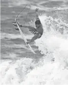  ?? FRANCISCO SECO/AP ?? Kolohe Andino goes airborne during the men’s surfing competitio­n Monday. He scored 8.5 on his best move, a slob frontside air reverse.