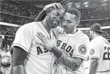  ?? Karen Warren / Staff photograph­er ?? Designated hitter Yordan Alvarez, left, and shortstop Carlos Correa helped power the Astros to the World Series.