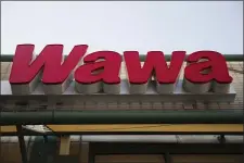  ?? ASSOCIATED PRESS ?? This file photo shows a Wawa convenienc­e store in Philadelph­ia. The Wawa convenienc­e store chain says a data breach may have collected debit and credit card informatio­n from thousands of customers.