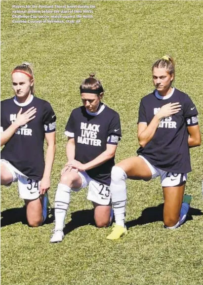  ??  ?? Players for the Portland Thorns kneel during the national anthem before the start of their NWSL Challenge Cup soccer match against the North Carolina Courage in Herriman, Utah. AP