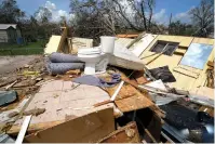 ?? The Associated Press ?? Remnants of the half destroyed mobile home of James Towfley, who is living in the standing half, are seen Aug. 30, 2020, in Lake Charles, La., in the aftermath of Hurricane Laura.