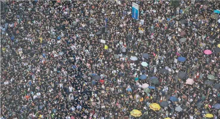  ?? Photo: Chris McGrath ?? Protestors gather along Hennessy Road, Hong Kong, on July 21, 2019.