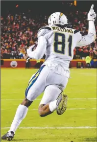  ?? The Associated Press ?? FINALLY: Los Angeles receiver Mike Williams celebrates Thursday in Kansas City, Mo., after catching the winning 2-point conversion pass for the Chargers’ first victory against the Chiefs since 2013.