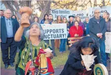  ?? EDDIE MOORE/JOURNAL ?? Concha Garcia, left, from Oaxaca, Mexico, and Jolen Eustace, from Zuni Pueblo, bless a rally in support of sanctuary cities outside City Hall in Santa Fe on Dec. 14.