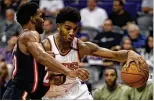  ?? MATT YORK / AP ?? Justise Winslow (left) might be the answer for the Heat in their search for a starting power forward. He scored 14 points against the Suns.