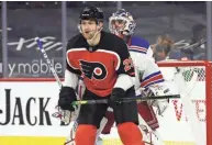  ?? KYLE ROSS/USA TODAY SPORTS ?? Flyers’ James van Riemsdyk stands in front of Rangers goalie Igor Shesterkin on March 27. The Seattle Kraken may target van Riemsdyk in this summer’s expansion draft.