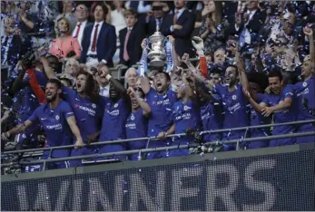  ??  ?? Chelsea’s team captain Gary Cahill lifts the trophy after winning the English FA Cup final soccer match between Chelsea and Manchester United at Wembley stadium in London on Saturday. Chelsea defeated Manchester United 1-0. AP PHOTO/TIM IRELAND JOSEK