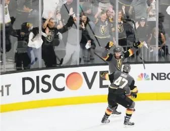  ?? Marc Sanchez / Associated Press ?? Vegas right wing Reilly Smith celebrates what turned out to be his game- winning goal with Luca Sbisa in the third period against Winnipeg. The Golden Knights lead the West finals 3- 1.