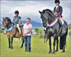  ??  ?? Working hunter champion Beth Hamilton with Kissme and reserve champion Rosie Wilkinsoon With Milo.