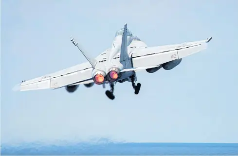  ?? EPA/JAKE CANNADY /US DOD ?? A F/A-18E Super Hornet aircraft. A US Navy F/A-18 shot down a Syrian government fighter jet on Sunday. Australia has suspended anti-IS strikes.