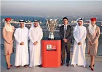  ??  ?? Officials pose with the 2019 AFC Asian Cup trophy in Dubai. The Asian Cup will start in Abu Dhabi on January 5.