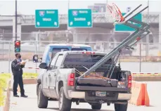  ?? LM OTERO/AP ?? A security guard checks a vehicle Thursday at a convention center used to hold migrant teens in Texas.