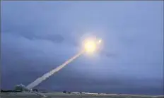  ?? RU-RTR Russian Television via AP ?? This video photograph shows the launch of what President Vladimir Putin said is Russia’s new nuclear-powered interconti­nental cruise missile. Mr. Putin declared Thursday that Russia has developed a range of new nuclear weapons, saying they can’t be...