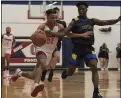  ?? JENNIFER FORBUS — FOR THE MORNING JOURNAL ?? As Oberlin’s Trajen Chambers races to the basket, Clearview’s Zion Capers tries to knock the ball loose.