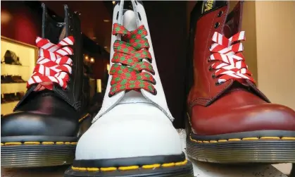  ?? Photograph: Richard Levine/Alamy ?? Shares in Dr Martens fell by a third on Tuesday and are now 80% down from 2021’s float price.