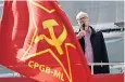  ??  ?? A communist flag flies in front of Jeremy Corbyn at a rally where he was speaking