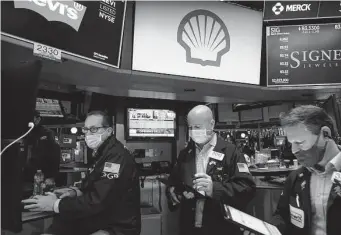  ?? Spencer Platt/Getty Images ?? Traders work on the floor of the New York Stock Exchange. Energy is the worst performing group in the S&P 500 Index over the past five sessions and was in the red again Friday.