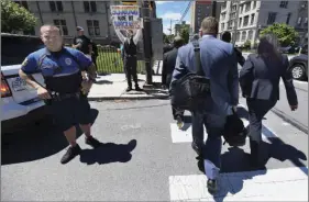  ??  ?? Jonathan Wilson, 33, of Scranton, Pa., holds a sign outside of a Lackawanna College were U.S. Attorney Jeff Sessions spoke on immigratio­n policy and law enforcemen­t actions, Friday in Scranton, Pa. Attendees who took part in listening to the speech cross the street at right. BUTCH COMEGYS/THE TIMES-TRIBUNE VIA AP