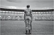  ?? AP Photo/Ben Curtis ?? A Zimbabwean soldier stands at attention during a dress rehearsal Thursday ahead of today’s presidenti­al inaugurati­on of Emmerson Mnangagwa at the National Sports Stadium in Harare, Zimbabwe.