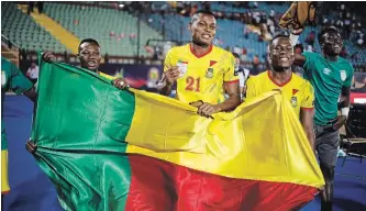  ?? ARIEL SCHALIT THE ASSOCIATED PRESS ?? Team Benin celebrates its first win in African Cup of Nations round of 16 play Friday over Morocco in Cairo.