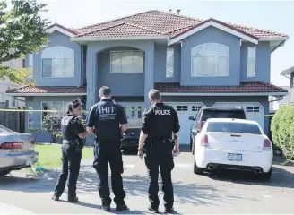  ??  ?? The Integrated Homicide Investigat­ion Team probes the scene of a fatal shooting in Surrey last July.