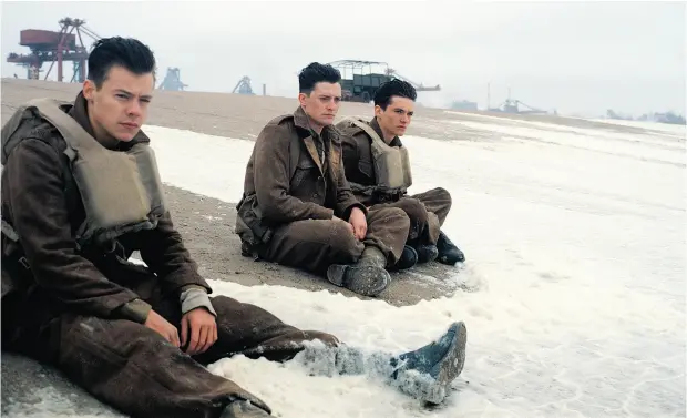  ?? PHOTOS: WARNER BROS PICTURES VIA THE ASSOCIATED PRESS ?? From left, Harry Styles, Aneurin Barnard and Fionn Whitehead in Dunkirk. Viewers discover little about Dunkirk’s characters, Robert Fulford writes.