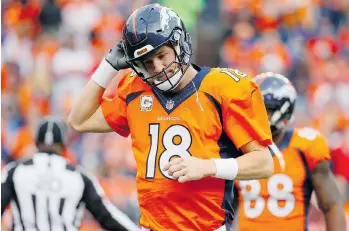  ?? JACK DEMPSEY/THE ASSOCIATED PRESS ?? Injured Denver quarterbac­k Peyton Manning has seen the Broncos excel without him.